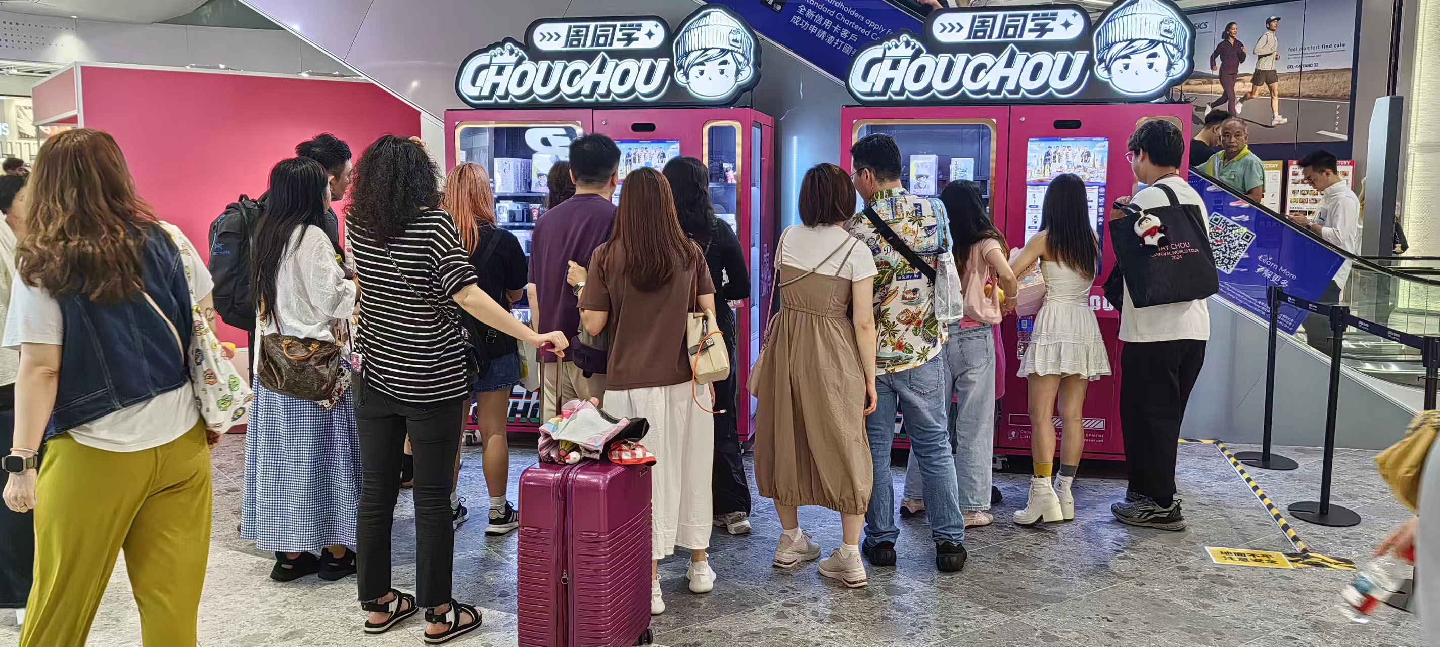 Turn Fan Hype into Real Profit — Smart Retail for IP Merchandise Sales. people are around the Weimi Jaychou IP merch vending machine