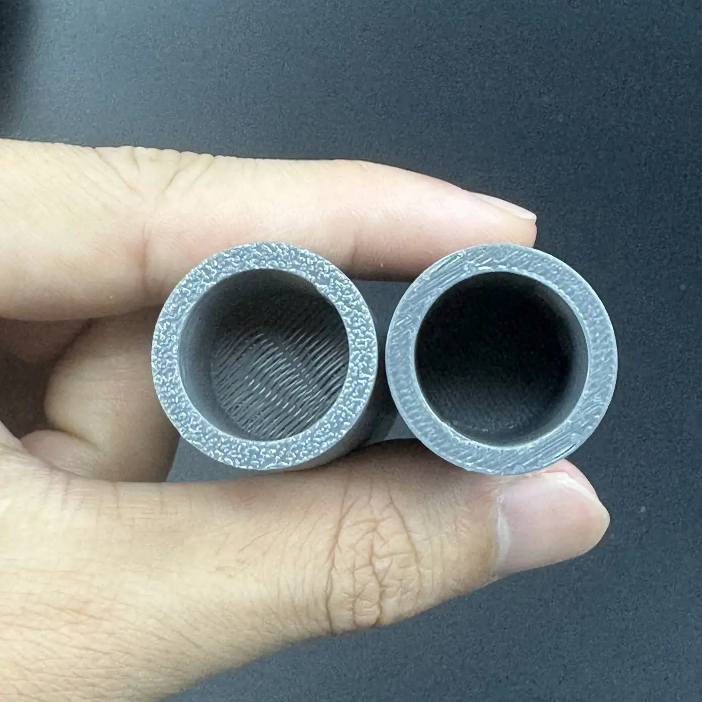 two dual-depth PETG cavities held end-up showing 16 mm bore with different depths for 2ml and 5ml vials