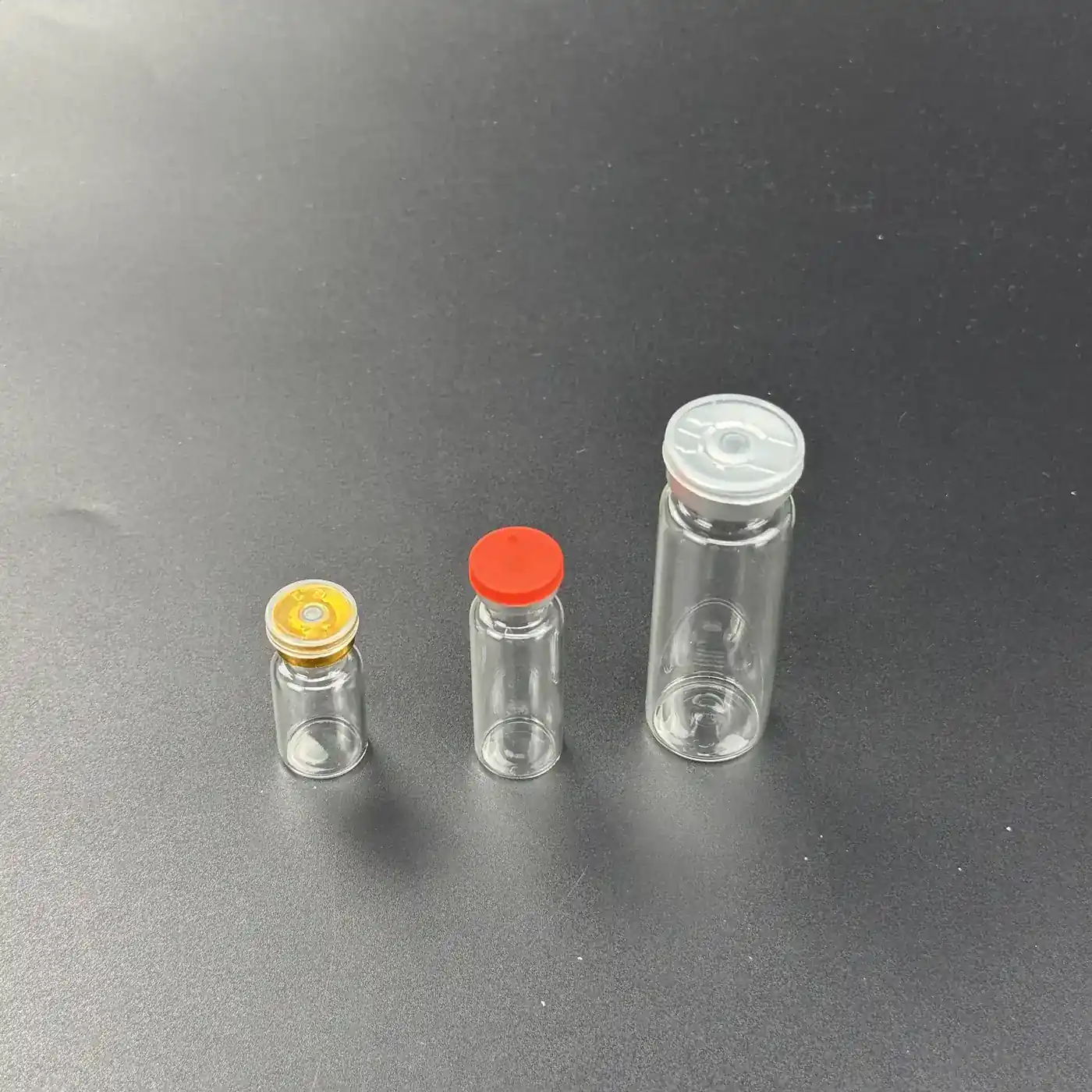 16mm 2ml vial, 16mm 5ml vial and 22mm 15ml glass vial side by side