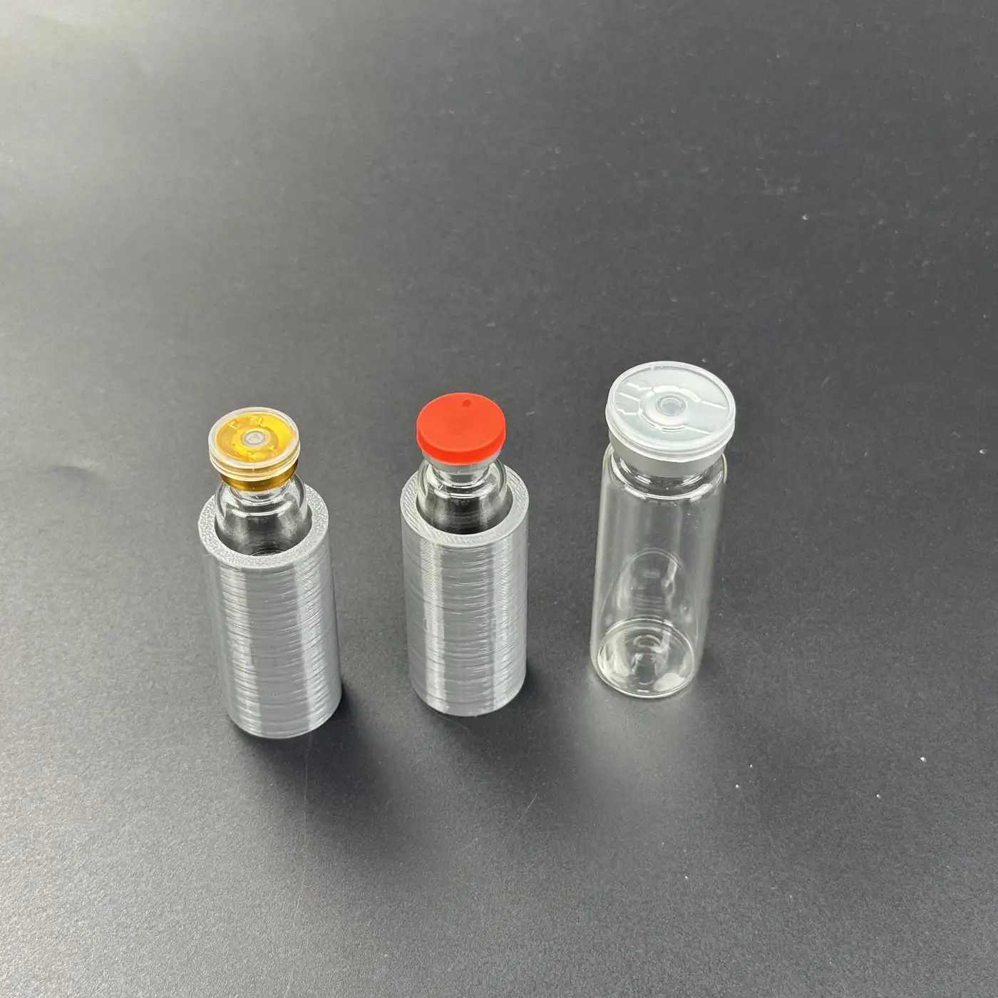 cavities-C02.webp2ml and 5ml vials seated inside dual-depth PETG cavities next to a bare 15ml vial