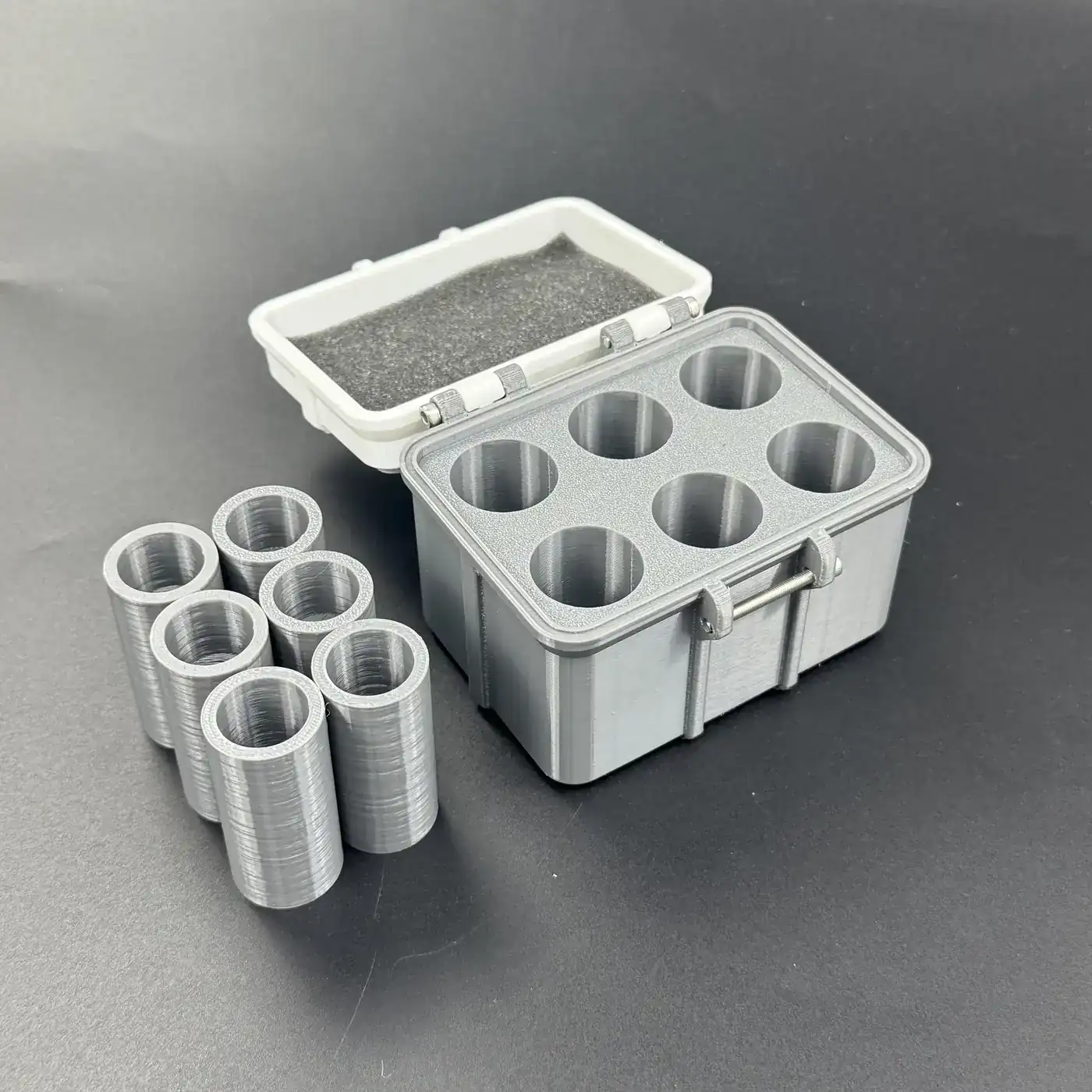 multi-size vial storage box with lid open and all six cavities arranged beside it, full kit view