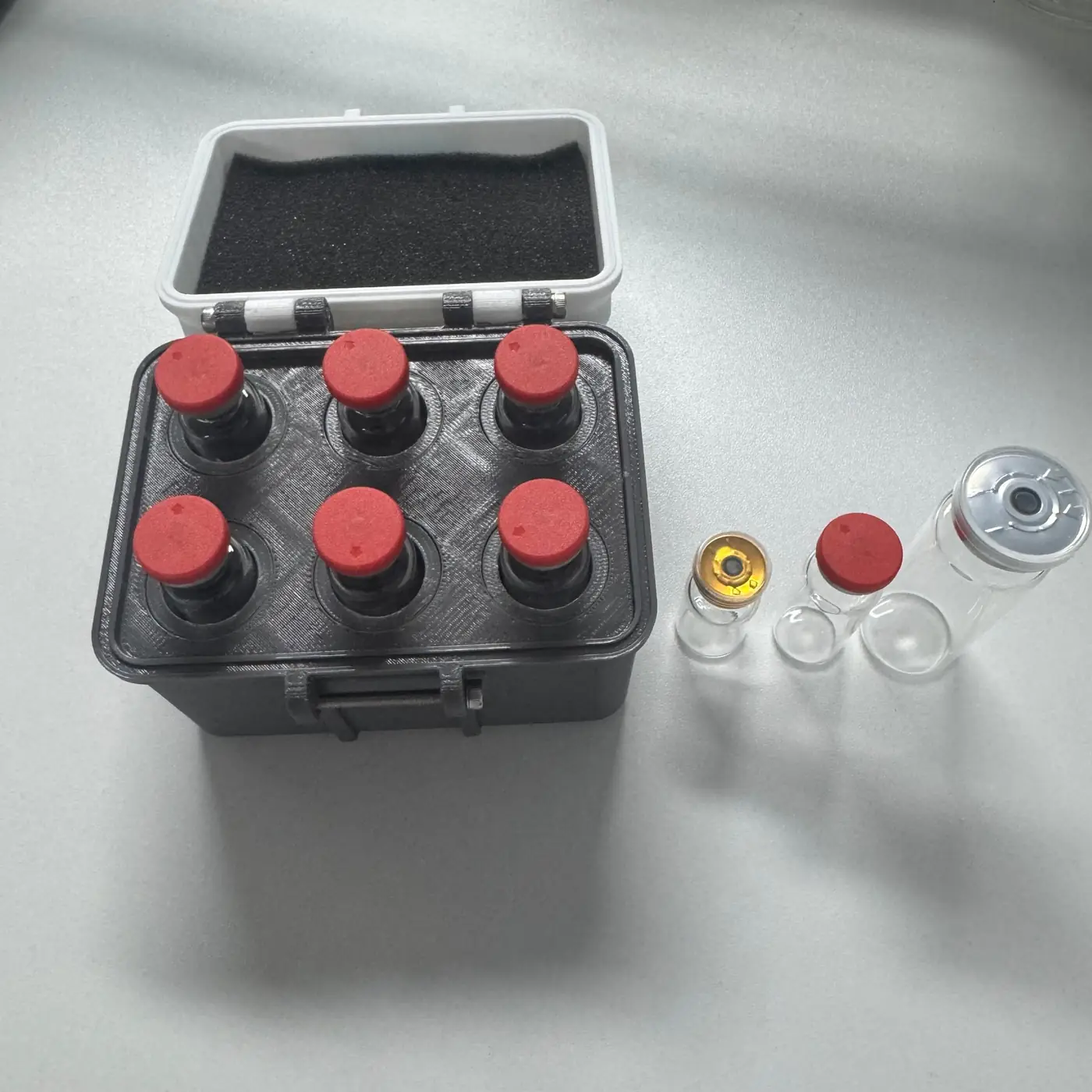 six 5ml vials seated flush in the 16 mm slots