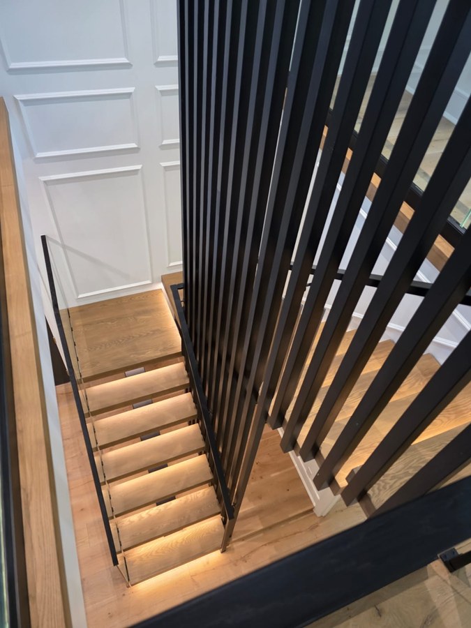 Overhead view of Charleston square tube stair with LED under treads and vertical screen